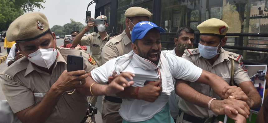 Delhi Police detained Indian Youth Congress (IYC) party activists in New Dehli on June 11, 2021.