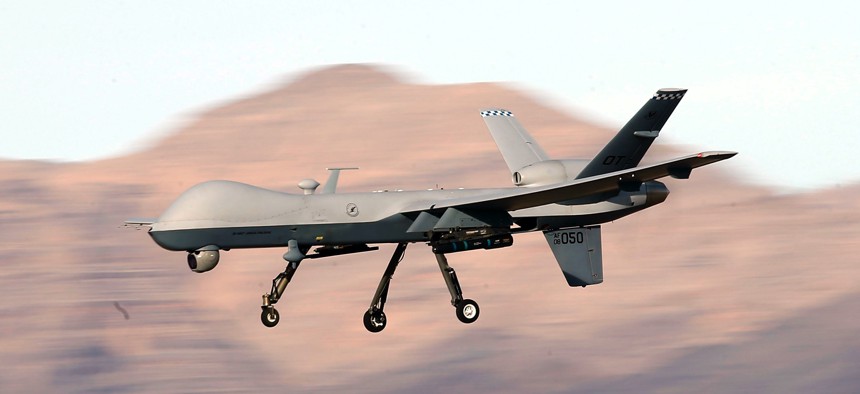 An MQ-9 Reaper remotely piloted aircraft (RPA) flies by during a training mission at Creech Air Force Base in 2015.