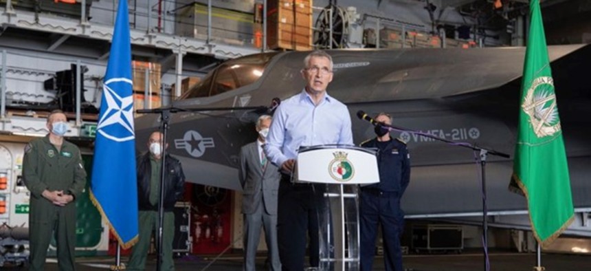 NATO Secretary General Jens Stoltenberg with a U.S. Marine Corps F-35B aboard HMS Queen Elizabeth, May 27, 2021. (NATO photo)