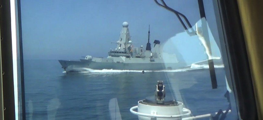 A photo provided by Russian state media shows how close a Russian vessel came to HMS Defender on June 23.