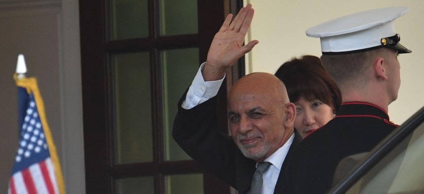 Afghan President Ashraf Ghani waves as he arrives to the White House to meet with US President Joe Biden in Washington, DC, on June 25, 2021.