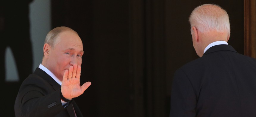 Russian President Vladimir Putin (L) greets President of USA Joe Biden (R) during the US - Russia Summit 2021 at the La Grange Villa near the Geneva Lake, on June 16, 2021 in Geneva, Switzerland. 