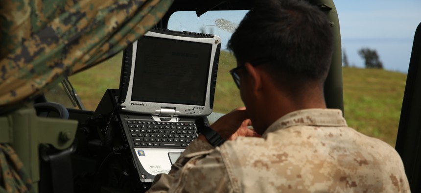 A Navy corpsman prepares the Tactical Tele-Medicine device for possible use during the Rim of the Pacific 2014 exercise. The device was being field tested by the Marine Corps Warfighting Lab.