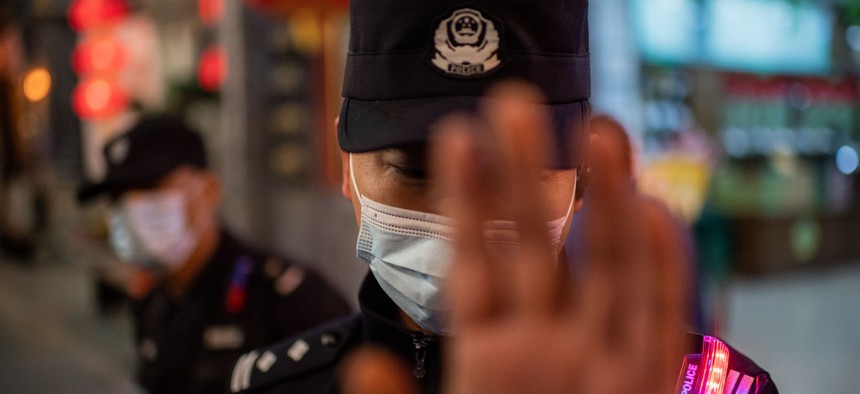  A police officer wearing a face mask in Beijing.