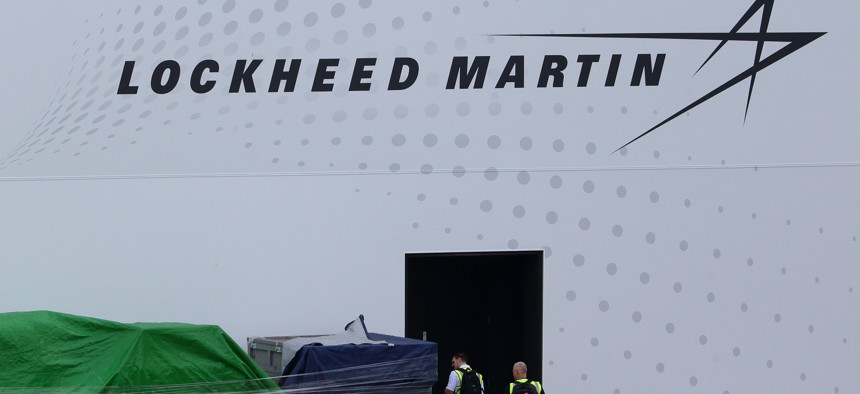 A man looks at the container goods sitting outside the Lockheed Martin booth during the Singapore Airshow media preview on February 9, 2020 in Singapore. 