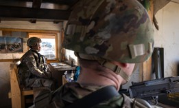 U.S. Army soldiers look onto Baghdad from a guardhouse on the perimeter of the International Zone on May 30, 2021 in Baghdad, Iraq.