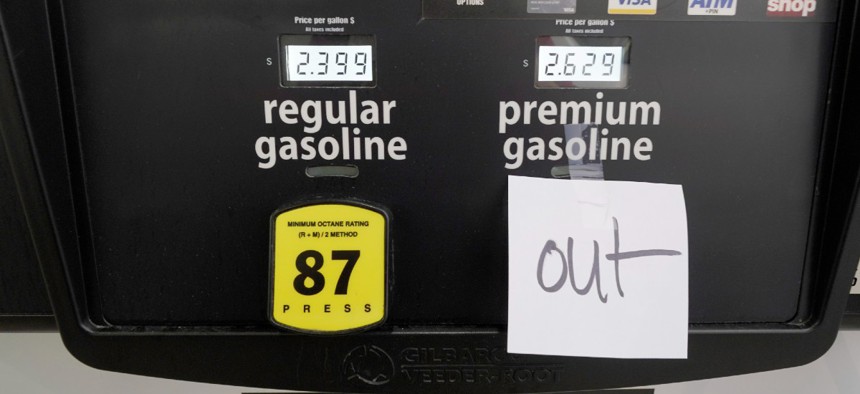A note posted at a gas pump indicates the pump is out of premium gasoline at a Costco Warehouse fuel station, Tuesday, May 11, 2021, in Ridgeland, Miss.