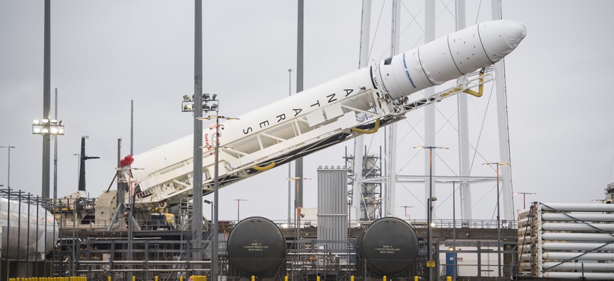 An Antares rocket carrying a Cygnus resupply spacecraft is raised into a vertical position at NASA's Wallops Flight Facility in Virginia, February 5, 2020. 