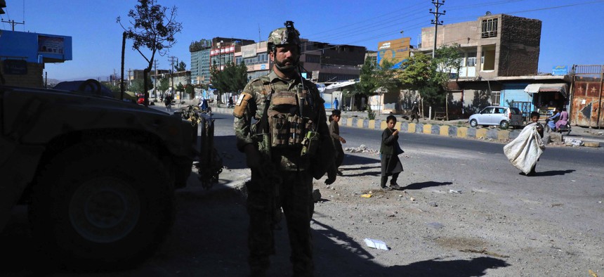 An Afghan security force personnel stands guard along the roadside in Herat on August 12, 2021, as Taliban took over the police headquarters in Herat, Afghanistan's third-largest city.