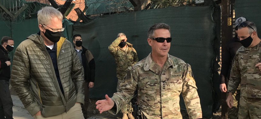 A December 2020 photo shows Acting Defense Secretary Chris Miller, left, with Gen. Austin Scott Miller, the last commander of U.S. forces in Afghanistan.
