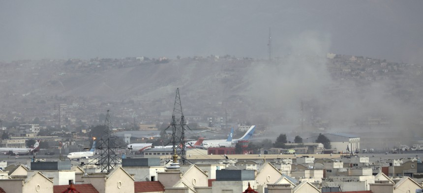 Smoke rises from a deadly explosion outside the airport in Kabul, Afghanistan, Thursday, Aug. 26, 2021.