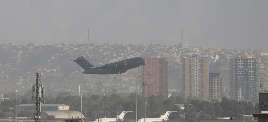 A U.S. plane leaves Kabul airport as evacuations continue, a day after an explosion outside a crowded airport gate in Afghanistan on August 27, 2021. 