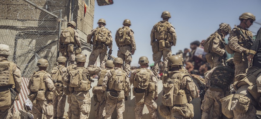 U.S. Marines assist with security at an Evacuation Control Checkpoint at Hamid Karzai International Airport, Kabul, Afghanistan, Aug. 26, 2021.