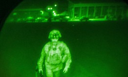 Maj. Gen. Chris Donahue, commander of the U.S. Army 82nd Airborne Division, boards a C-17 cargo plane at Hamid Karzai International Airport in Kabul on Aug. 30, 2021. becoming the last U.S. service member to leave after 20 years of war in Afghanistan.