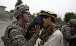 A U.S. Army soldier scans the irises of an Afghan civilian in 2012 as part of an effort by the military to collect biometric information from much of the Afghan population.