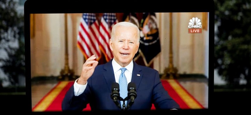 President Joe Biden is seen on screen as he delivers remarks at the White House in Washington D.C. Aug. 31, 2021.