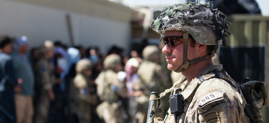A paratrooper assigned to the 1st Brigade Combat Team, 82nd Airborne Division, conducts security at Hamid Karzai International Airport in Kabul, Aug 26, 2021.