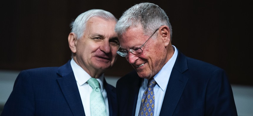 Chairman Jack Reed, D-R.I., left, and ranking member Sen. Jim Inhofe, R-Okla., arrive for a Senate Armed Services Committee hearing on June 15, 2021.