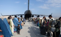 U.S. Air Force loadmasters and pilots load passengers aboard a U.S. Air Force C-17 Globemaster III in support of the Afghanistan evacuation at Hamid Karzai International Airport, Afghanistan, Aug. 24, 2021.