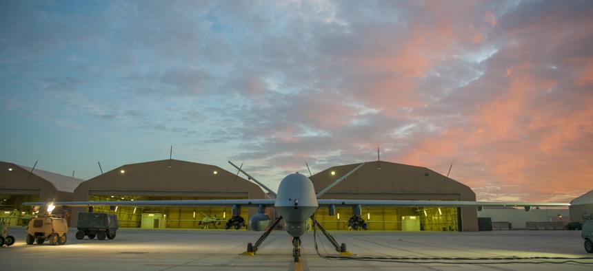 An MQ-9 Reaper equipped with an extended range modification from the 62nd Expeditionary Reconnaissance Squadron sits on the ramp at Kandahar Airfield, Afghanistan, Dec. 6, 2015. 