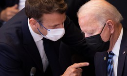 France's President Emmanuel Macron (L) talks to US President Joe Biden before a meeting of the North Atlantic Council at the North Atlantic Treaty Organization (NATO) headquarters in Brussels on June 14, 2021. 