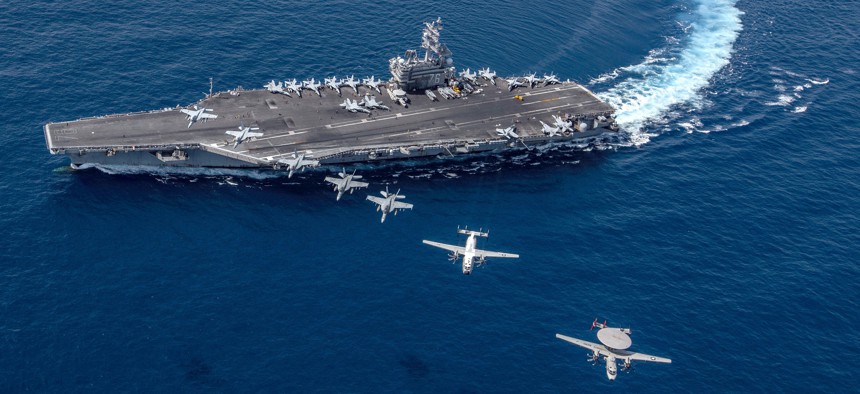Multiple aircraft from Carrier Air Wing 5 fly in formation over the Navy’s forward-deployed aircraft carrier USS Ronald Reagan.