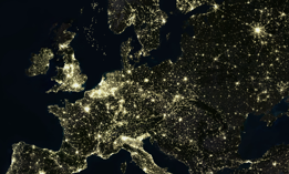 True colour satellite image of Europe at night with country borders.