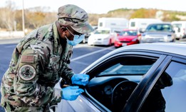 Texas Air National Guard members work a drive-through COVID-19 vaccination site March 15, 2021, at Dietert Center in Kerrville, Texas.