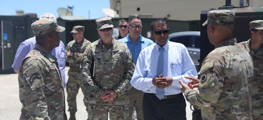 Leaders of the U.S. Army Pacific welcome Dr. Raj Iyer, chief information officer for the U.S. Army, to show the capabilities of USARPAC in Forager 21 at Andersen Air Force Base, July 28, 2021.
