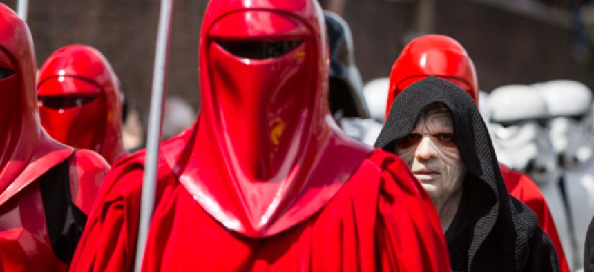  “Star Wars” fans dressed as the Imperial Guard and the Emperor—a Sith lord—walk in parade in the streets of Rome in 2014.