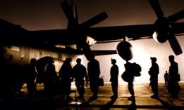 A group of U.S. Army Soldiers line up to board a C-130 Hercules at Bagram Air Field, Afghanistan, Nov. 30, 2008.