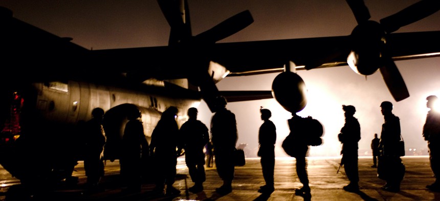 A group of U.S. Army Soldiers line up to board a C-130 Hercules at Bagram Air Field, Afghanistan, Nov. 30, 2008.