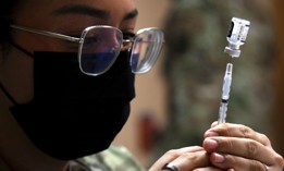 Air Force Senior Airman Sara Sanchez with the 6th Health Care Operations Squadron prepares a COVID-19 vaccine at MacDill Air Force Base, Fla., Sept. 30, 2021. 