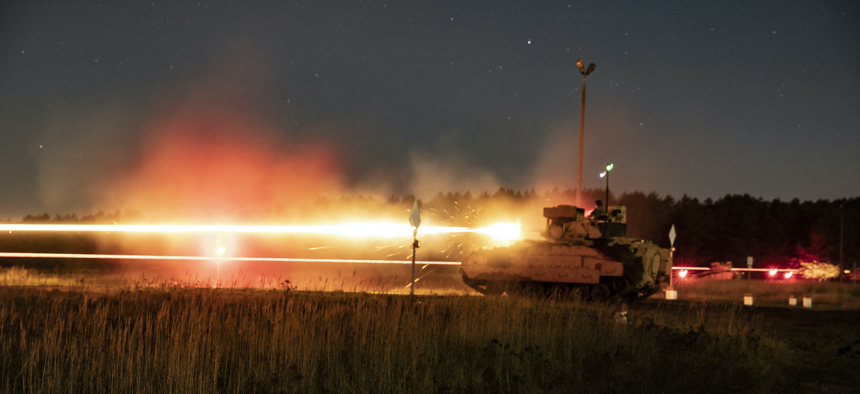 Soldiers with the 1st Armored Brigade Combat Team, 1st Infantry Division (1ID) conduct a nighttime live-fire exercise with M2A3 Bradley Fighting Vehicles during Victory Eagle at Drawsko Pomorskie Training Area, Poland, on Oct. 24, 2021. 