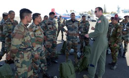 A U.S. Air Force C-130 Super Hercules pilot briefs Indian Air Force Airmen prior to a joint U.S. and India Special Forces combined free-fall jump during Aero India 2017 at Air Force Station Yelahanka, Bengaluru, India, Feb. 15, 2017. 