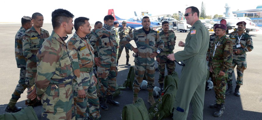 A U.S. Air Force C-130 Super Hercules pilot briefs Indian Air Force Airmen prior to a joint U.S. and India Special Forces combined free-fall jump during Aero India 2017 at Air Force Station Yelahanka, Bengaluru, India, Feb. 15, 2017. 