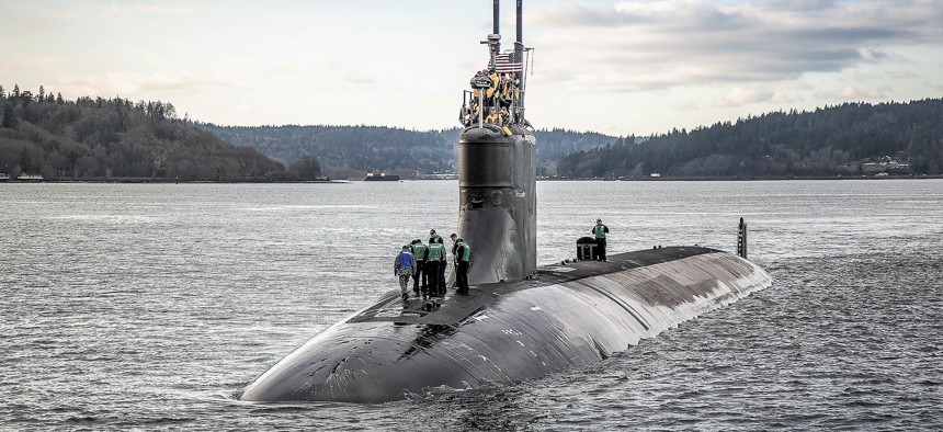 The Seawolf-class fast-attack submarine USS Connecticut (SSN 22) departs Puget Sound Naval Shipyard for sea trials following a maintenance availability, Dec. 15, 2016, in Washington.