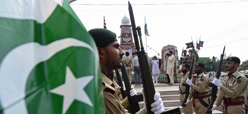 Pakistan's soldiers take part in a ceremony to mark country's Defence Day as they pay tribute to their comrades who lost their lives during the India-Pakistan war in 1965, at Yadgar-e-Shuhada in Lahore on September 6, 2021.