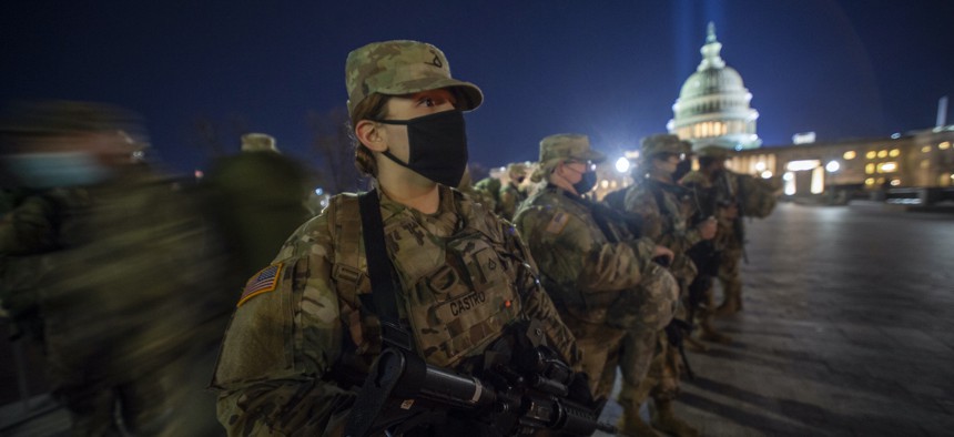 Oklahoma Army National Guard Soldiers receive instructions as they begin their first shift providing security near the U.S. Capitol building, Jan. 19, 2021.