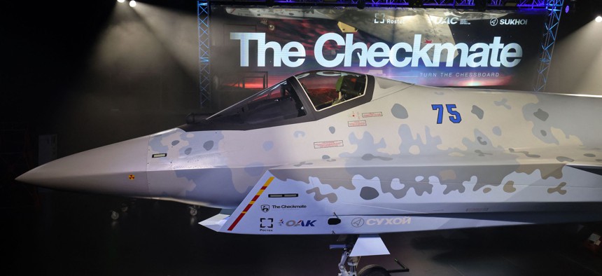 This picture taken on November 16, 2021 shows a view of the mockup of Russia's recently unveiled Sukhoi Su-75 "Checkmate" Light Tactical Aircraft, a stealth warplane competing with the US F-35 Lighting II, on display during the 2021 Dubai Airshow.