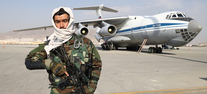 A member of the Taliban movement (banned in Russia) stands guard at Kabul airport where an Ilyushin Il-76 airlifter of the Russian Aerospace Forces has delivered humanitarian aid