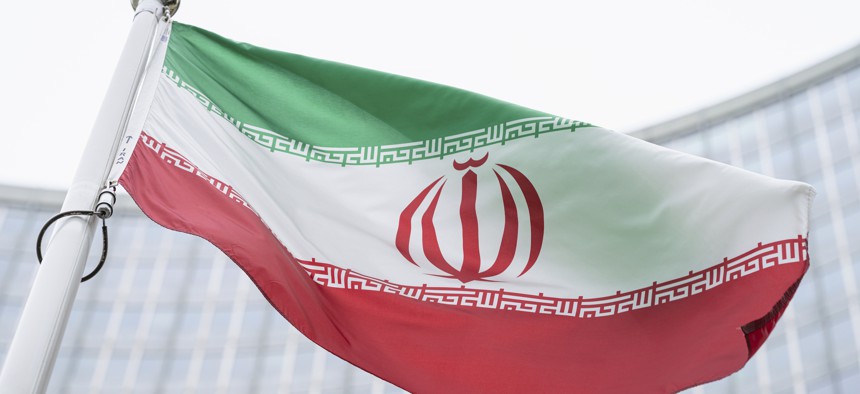 The flag of Iran waves in front of the the International Center building with the headquarters of the International Atomic Energy Agency, IAEA, in Vienna, Austria, May 24, 2021. 