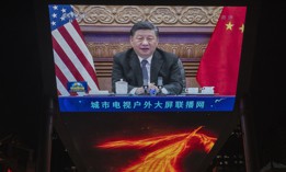  A large screen displays China's President Xi Jinping during a virtual summit with United States President Joe Biden, not seen, during the evening CCTV news broadcast outside a shopping mall on November 16, 2021 in Beijing, China.