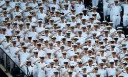 Sailors from the Merchant Marine Academy salute during the National Anthem before a baseball game at Citi Field on August 23, 2017, in New York City.