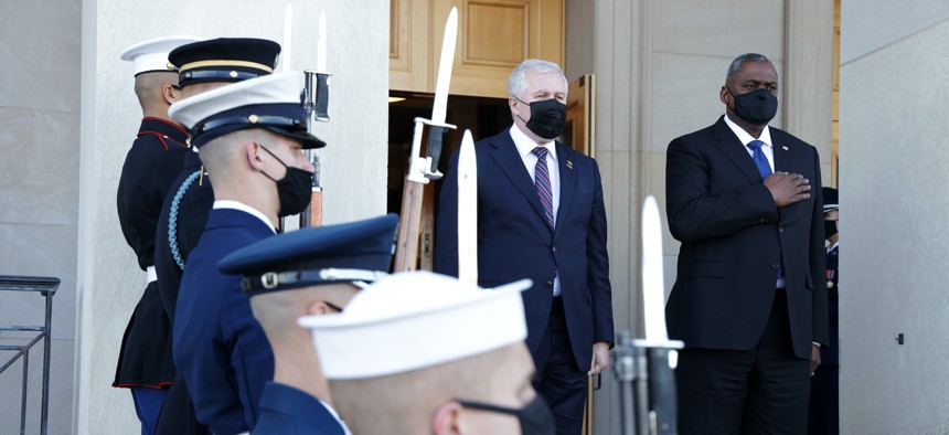 U.S. Secretary of Defense Lloyd Austin (R) welcomes Lithuanian Defense Minister Arvydas Anusauskas (L) to the Pentagon during an enhanced honor cordon December 13, 2021 in Arlington, Virginia.