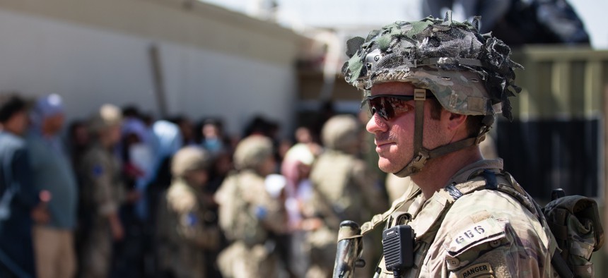 A U.S. Army soldier at the airport in Kabul as U.S. personnel and some Afghans evacuate.