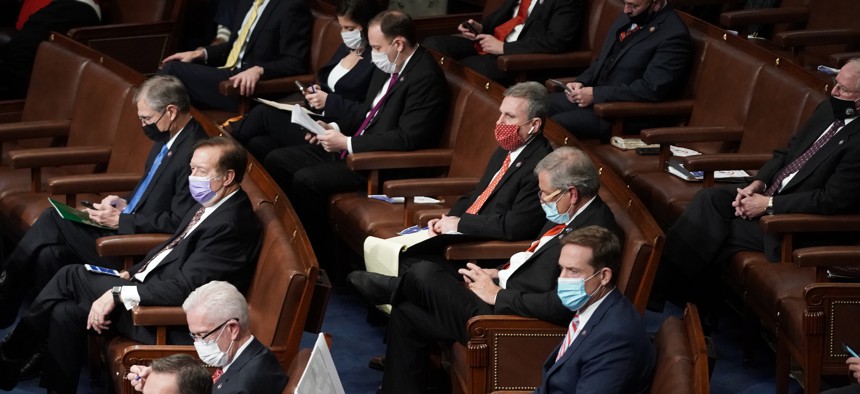 House Republicans are seen during a reconvening of a joint session of Congress to certify the Electoral College votes of the 2020 presidential election in the House chamber on January 6, 2021 in Washington, D.C.
