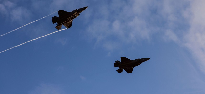 F-35 fighter jets perform in an air show at the graduation ceremony of Israeli pilots at the Hatzerim air force base in the Negev desert near the southern Israeli city of Beersheva, on December 22, 2021.