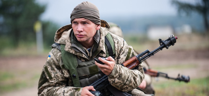 A Ukrainian marine provides security during a cordon and search mission during exercise Rapid Trident 2014 in Yavoriv, Ukraine, Sept. 23, 2014. 
