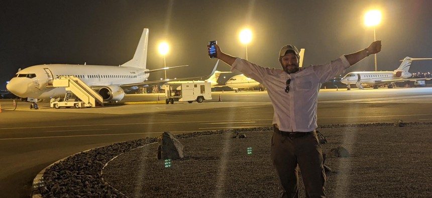 Project Dynamo founder Bryan Stern, bottom right, takes a photo in front of one of the many chartered aircraft he's been able to use to fly Americans and U.S. legal residents out of Kabul since U.S. forces withdrew. 